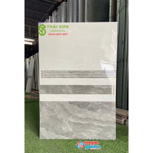 Gạch ốp tường phòng khách 30x60 bóng kiếng vân đá đậm nhạt