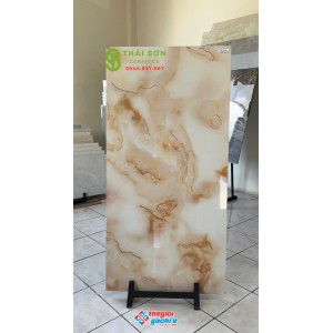 Gạch trung quốc 60x120 bóng kính khắc kim màu vàng kem ngọc trai