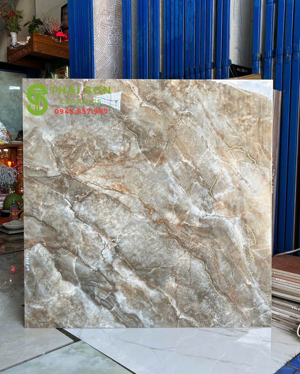 Gạch lát nền 80x80 trung quốc màu nâu đất khắc kim vàng