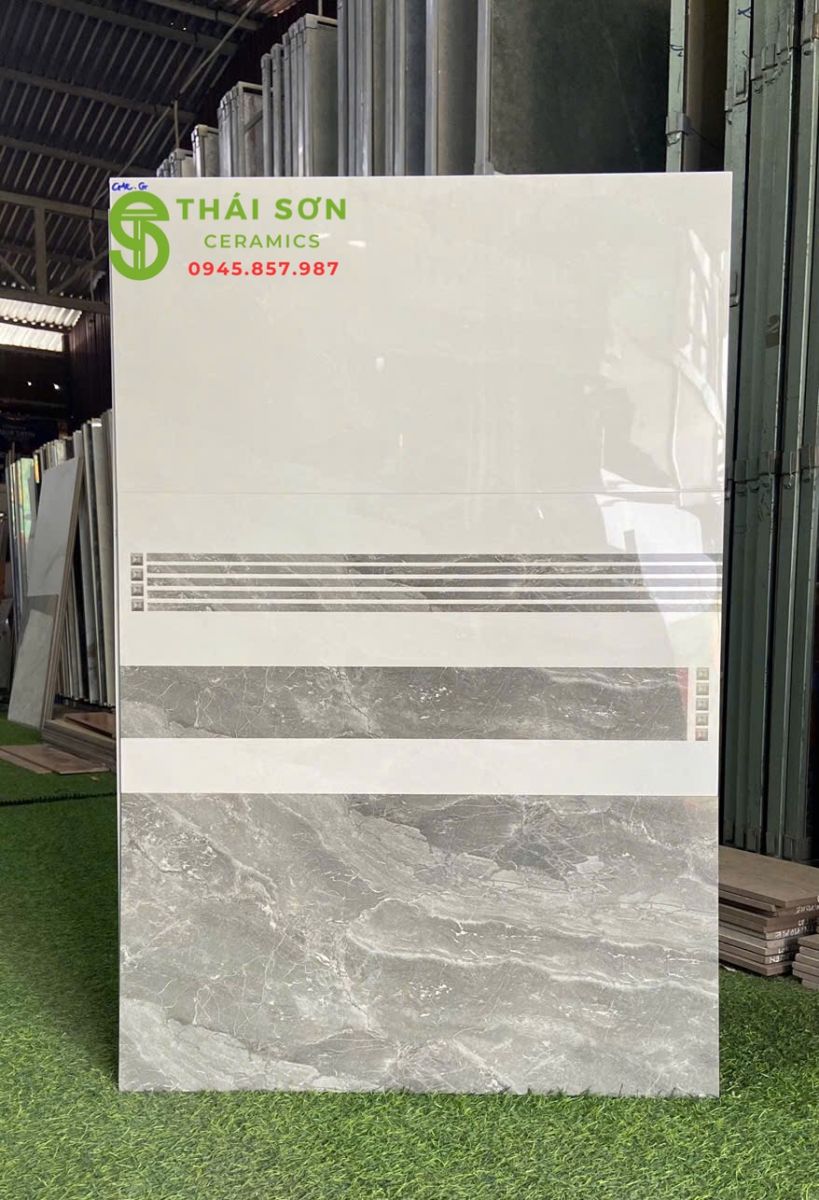 Gạch ốp tường phòng khách 30x60 bóng kiếng vân đá đậm nhạt